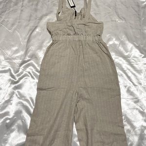 Beautiful tan/beige jumpsuit. Brand new with tags